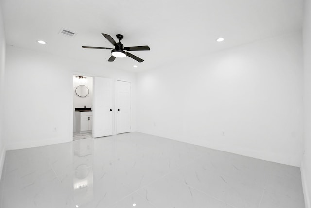 unfurnished room with ceiling fan