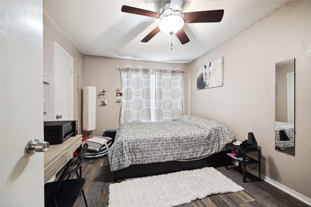 bedroom featuring dark hardwood / wood-style flooring and ceiling fan