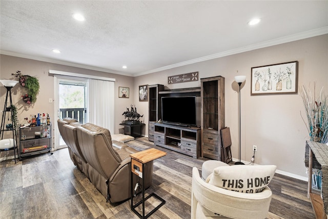 living room with hardwood / wood-style flooring, ornamental molding, and a textured ceiling