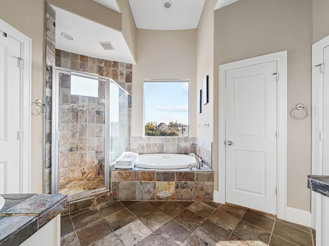 bathroom with separate shower and tub