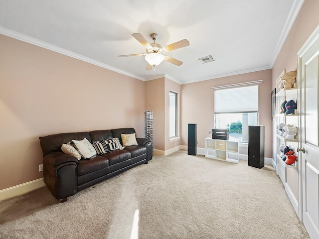 living room featuring ceiling fan, light colored carpet, and ornamental molding