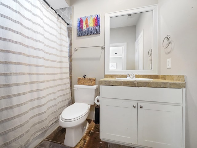 bathroom with vanity, wood-type flooring, and toilet