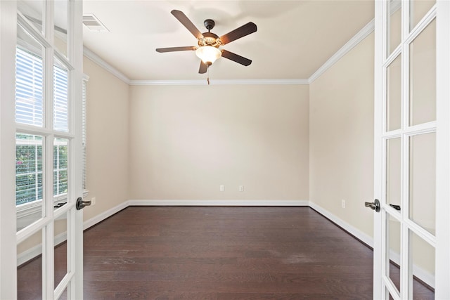 unfurnished room featuring french doors, crown molding, a wealth of natural light, and dark wood-type flooring