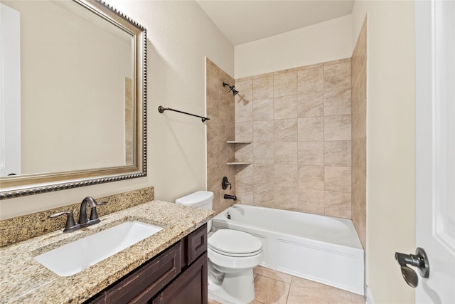 full bathroom featuring tile patterned floors, vanity, toilet, and tiled shower / bath