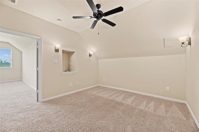 interior space with ceiling fan and vaulted ceiling