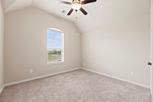 unfurnished room featuring carpet, ceiling fan, and vaulted ceiling