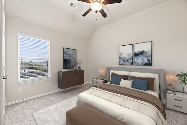 bedroom with ceiling fan, light colored carpet, and lofted ceiling