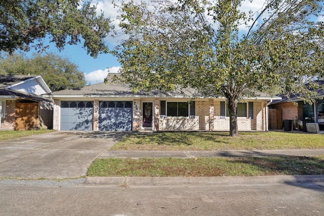 single story home with a front yard and a garage