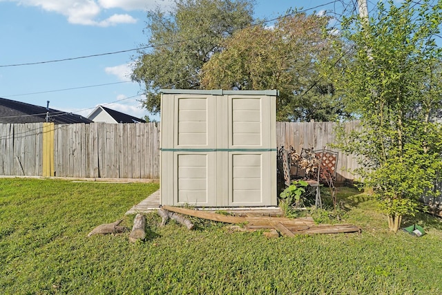 view of outbuilding featuring a lawn