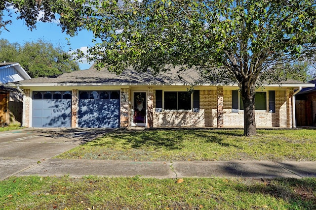 ranch-style home with a garage and a front lawn