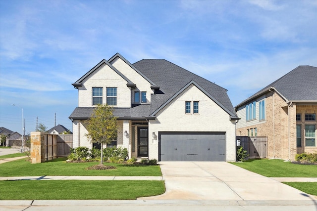 view of front of house featuring a front yard and a garage