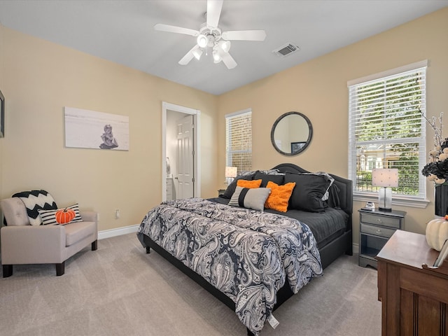 bedroom featuring ceiling fan and light colored carpet