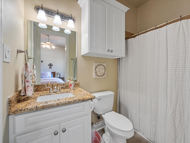 bathroom featuring ceiling fan, vanity, and toilet