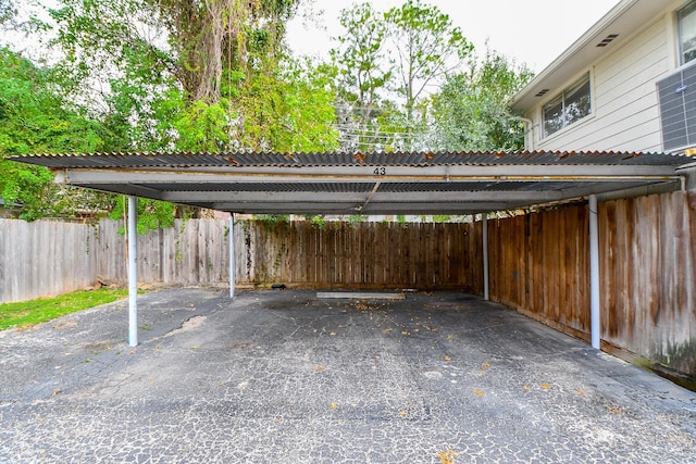 view of vehicle parking featuring a carport