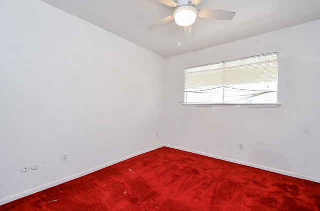 unfurnished room with carpet flooring and ceiling fan