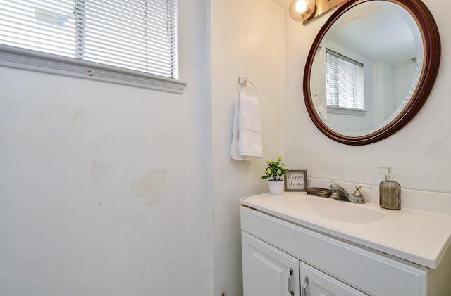 bathroom with plenty of natural light and vanity