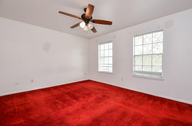 unfurnished room featuring carpet floors and ceiling fan