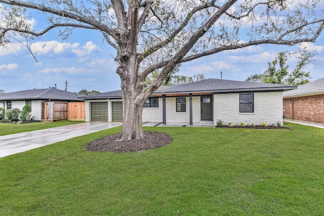 ranch-style house featuring a garage and a front yard