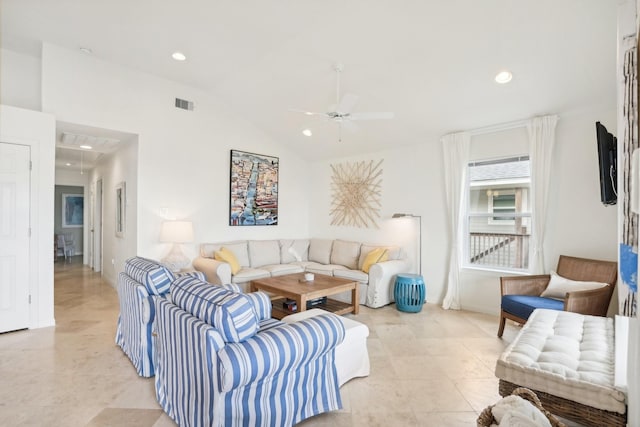 tiled living room featuring ceiling fan and vaulted ceiling