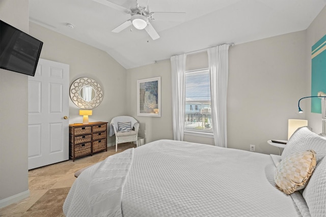 bedroom featuring ceiling fan and vaulted ceiling