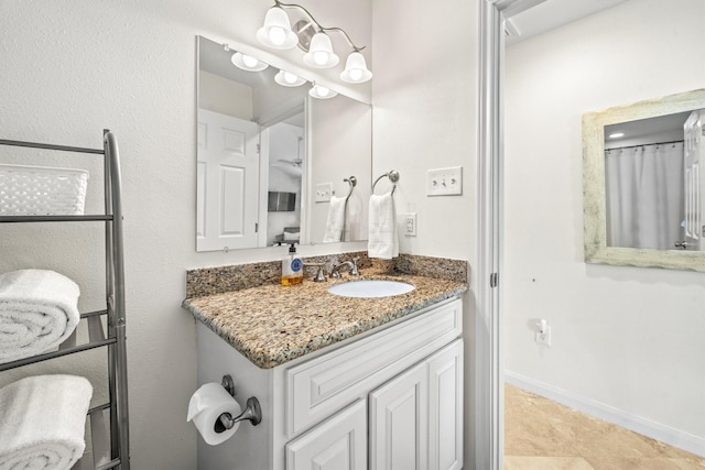 bathroom with tile patterned floors and vanity