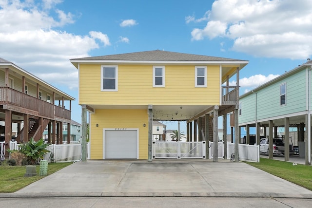 view of front of home with a carport and a garage