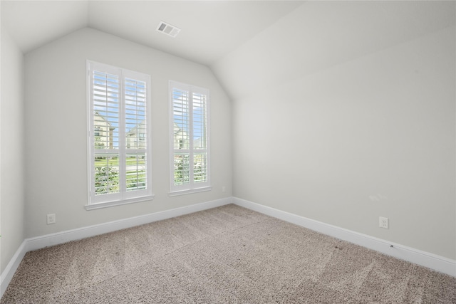 bonus room featuring carpet flooring and vaulted ceiling