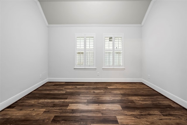 spare room with dark hardwood / wood-style floors and crown molding