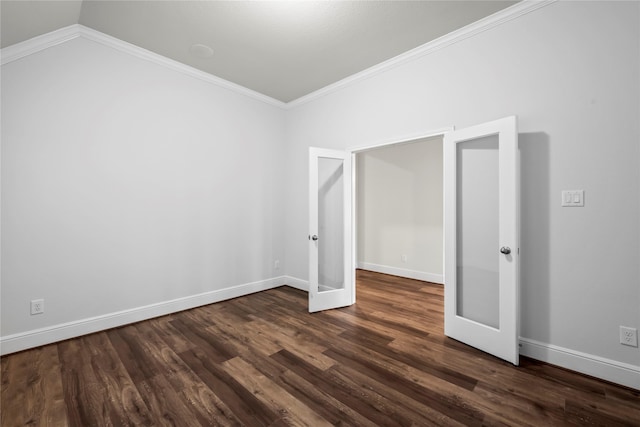 unfurnished room featuring french doors, dark wood-type flooring, ornamental molding, and lofted ceiling