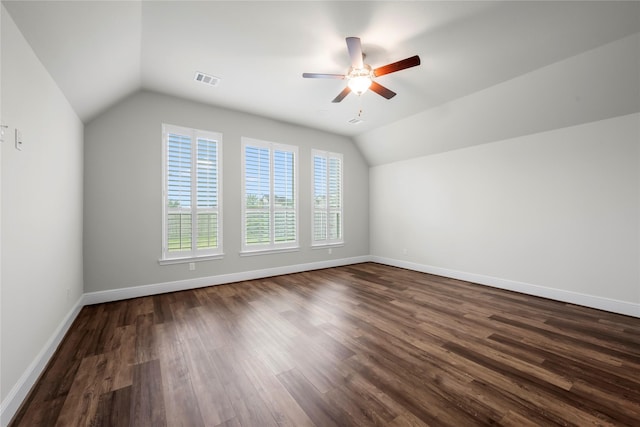 additional living space featuring ceiling fan, lofted ceiling, and dark wood-type flooring