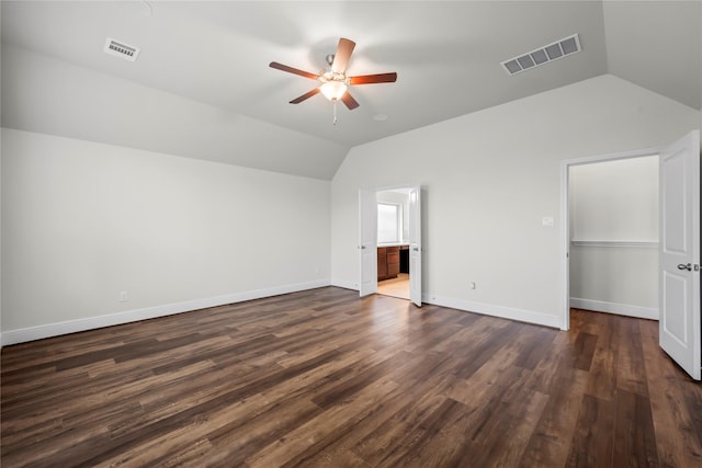 bonus room with ceiling fan, dark hardwood / wood-style flooring, and vaulted ceiling