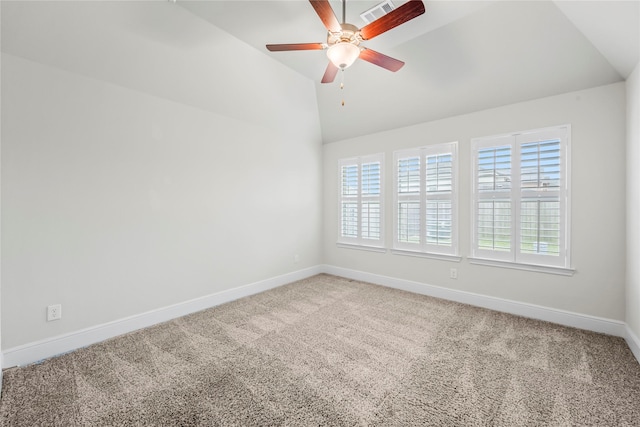 carpeted empty room featuring ceiling fan and lofted ceiling