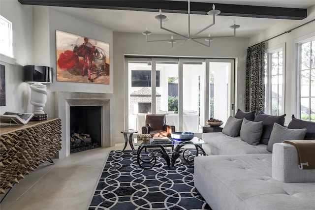 living room featuring beam ceiling and plenty of natural light