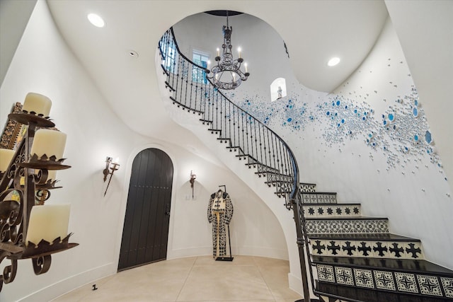 entrance foyer featuring tile patterned floors and a chandelier