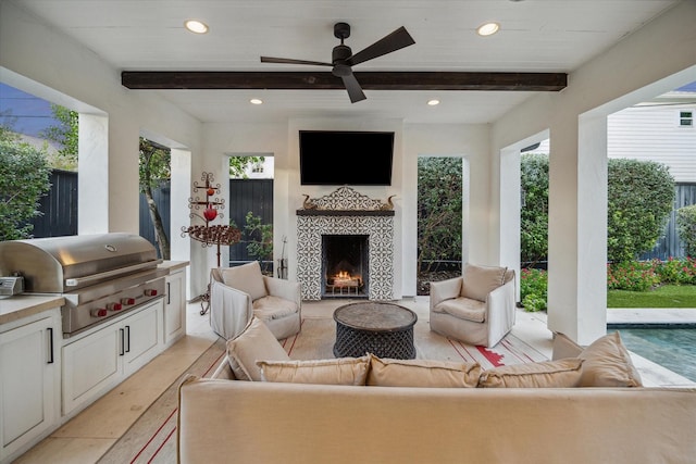 view of patio / terrace with an outdoor living space with a fireplace, area for grilling, grilling area, and ceiling fan