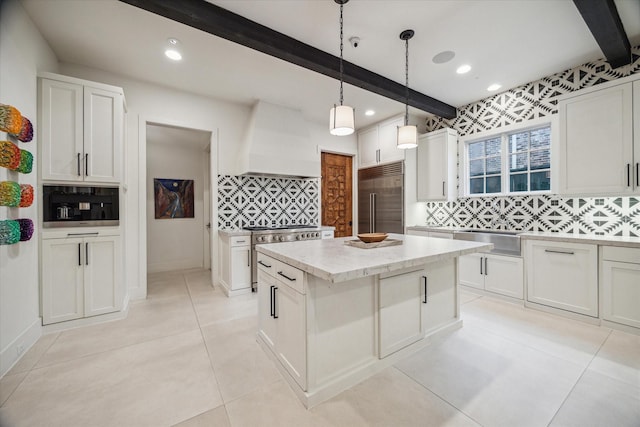 kitchen featuring beamed ceiling, custom range hood, premium appliances, and decorative backsplash