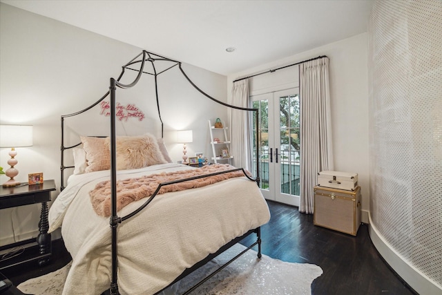 bedroom with access to outside, french doors, and dark hardwood / wood-style floors