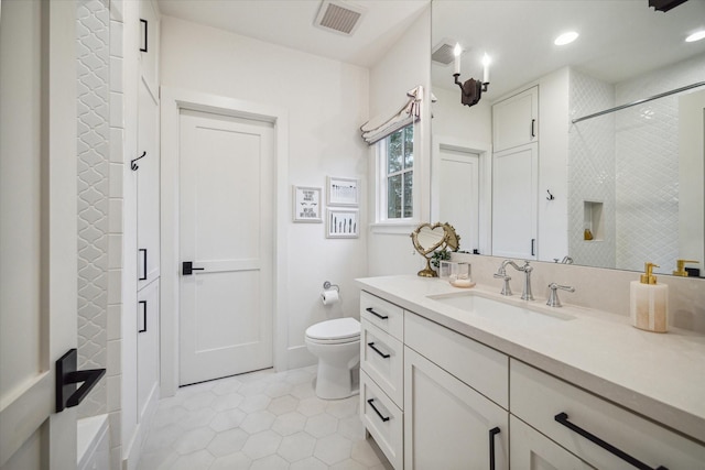 bathroom with a shower, tile patterned flooring, vanity, and toilet