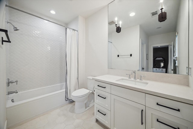 full bathroom featuring tile patterned floors, shower / bath combination with curtain, toilet, and vanity