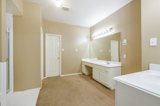 bathroom with vanity and walk in shower