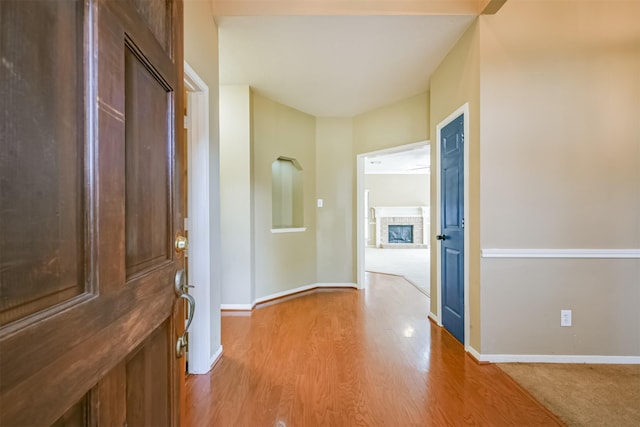 hall with light hardwood / wood-style flooring