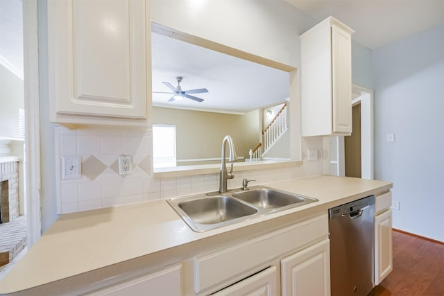 kitchen with dishwasher, backsplash, dark wood-type flooring, sink, and ceiling fan