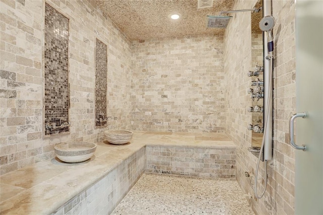 bathroom with a tile shower