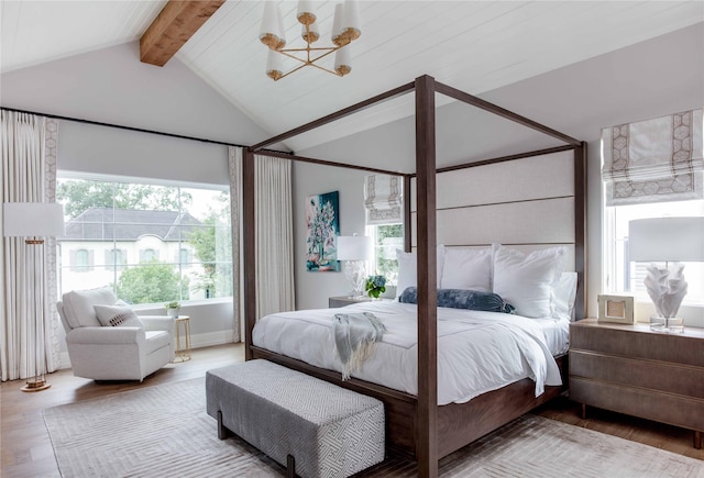 bedroom with hardwood / wood-style floors, lofted ceiling with beams, and a notable chandelier