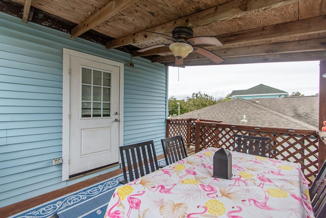 wooden terrace featuring ceiling fan