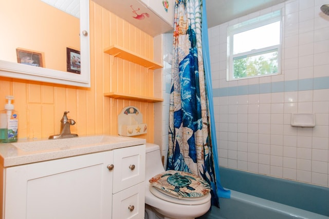 full bathroom with vanity, toilet, and shower / bath combo with shower curtain