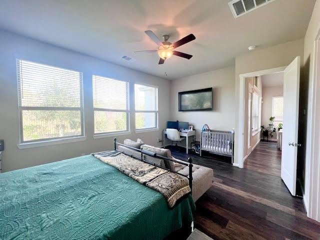 bedroom featuring ceiling fan and dark hardwood / wood-style flooring