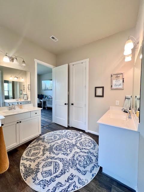 bathroom featuring vanity and hardwood / wood-style flooring