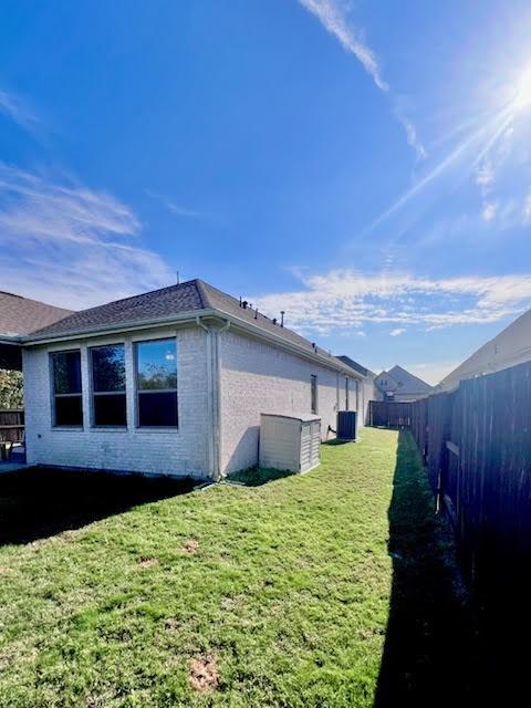 view of home's exterior with a yard