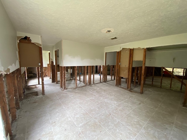 interior space with a textured ceiling